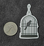 Black and White Bird 🐦 in a Cage Enchanted Sticker