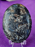 LG. Arfvedsonite aka Fireworks Stone w/Garnet Crystal Palmstone 🖤🎇🎆❤️