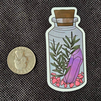 Crystals And Rosemary In Apothecary Bottle Enchanted Sticker